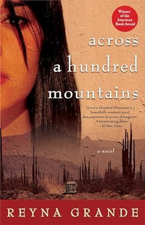 Book cover of Across a Hundred Mountains, written by Reyna Grande. There is a woman's face on the cover above a mountainous desert landscape.