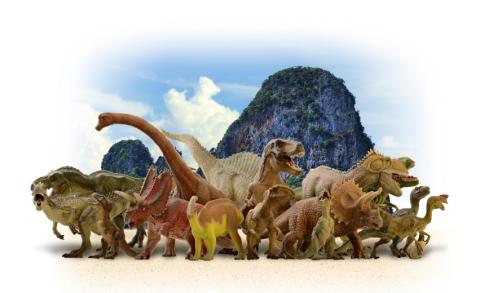 a group of dinosaurs standing in front of a mountain