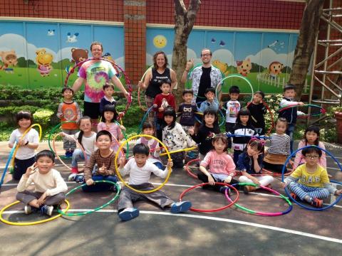 Pinto Bella Hoops amid children and hula hoops