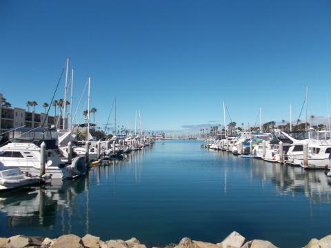 Picture of oceanside harbor featuring boats on the ocean
