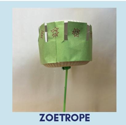 Green cardboard zoetrope on a stick