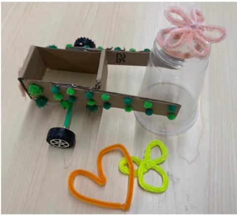 cardboard wagon attached to spero