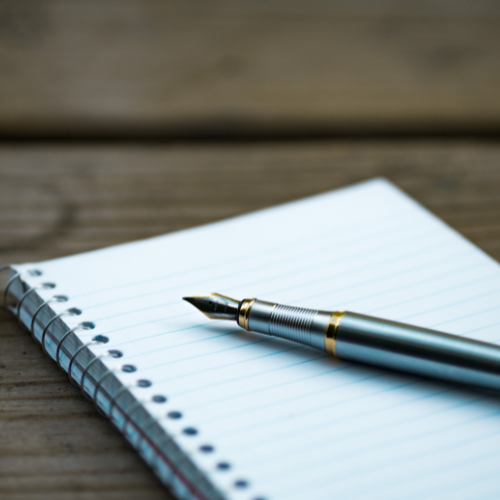 close up of notebook and fountain pen 