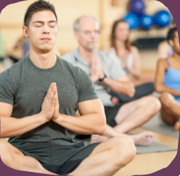 people sitting cross-legged meditating