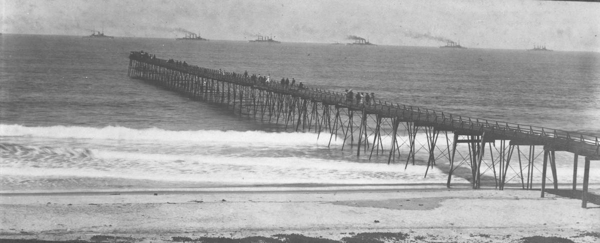 Historic photo of Oceanside from 1908 featuring great white fleet ships in background